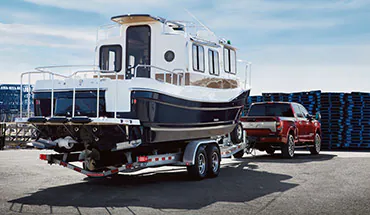 2022 Nissan TITAN Truck towing boat | Valley Nissan in Longmont CO