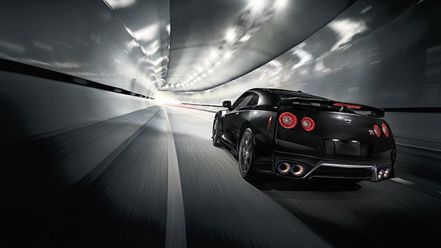 2023 Nissan GT-R seen from behind driving through a tunnel | Valley Nissan in Longmont CO
