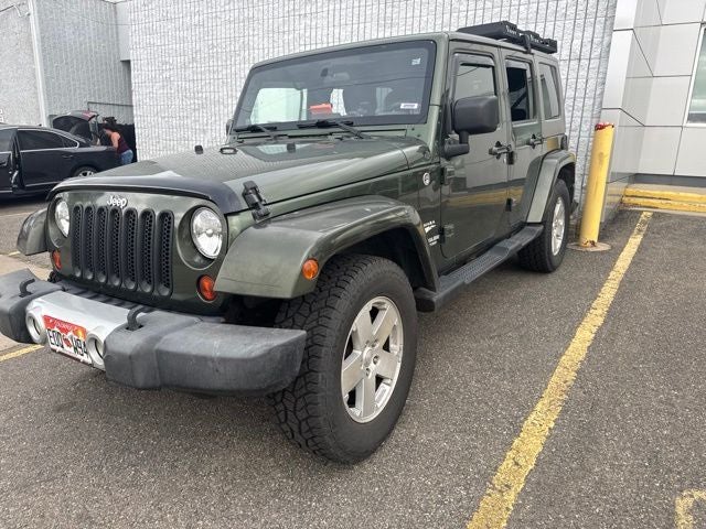 Used 2009 Jeep Wrangler Unlimited Sahara with VIN 1J4GA59179L704979 for sale in Longmont, CO